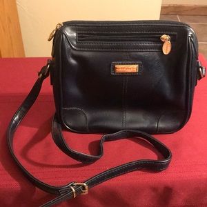 Liz Claiborne deep blue leather crossbody bag.